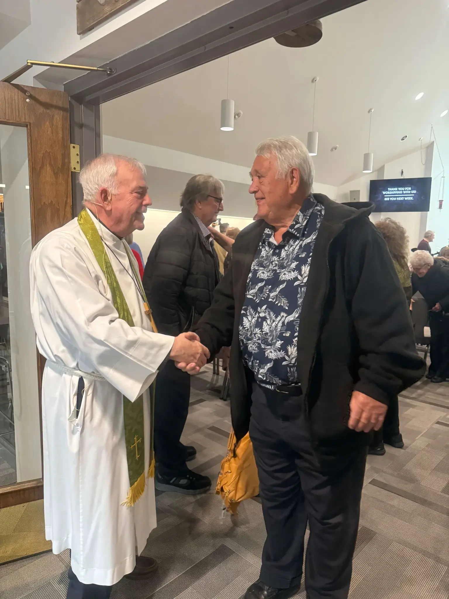 Pastor greeting a member at First Lutheran